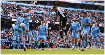 Jamaal Lascelles of Newcastle United heads the ball towards the goal during the Premier League match between Manchester City and Newcastle United at Etihad Stadium. Photo by Stu Forster.