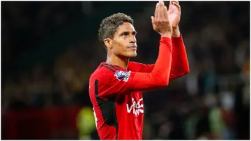 Raphael Varane applauds the fans after the Premier League match between Manchester United and Wolves at Old Trafford. Photo by Ash Donelon.