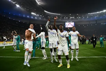 Real Madrid players celebrate after beating Liverpool in the Champions League final at the Stade de France in May