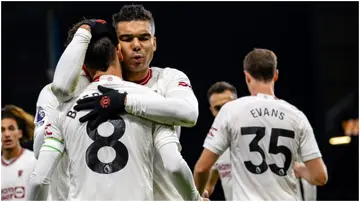 Bruno Fernandes celebrates with Casemiro after scoring during the Premier League match between Burnley FC and Manchester United at Turf Moor. Photo by Ash Donelon.