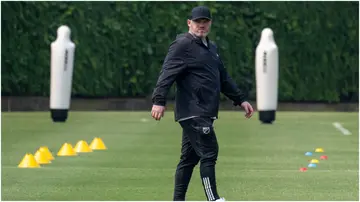 Wayne Rooney walks on the pitch during a Major League Soccer (MLS) All Stars training session at American University in Washington. Photo by Jim Watson.