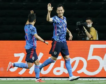 Japan captain Maya Yoshida (right) is hoping to lead his team into the World Cup quarter-finals for the first time in Qatar