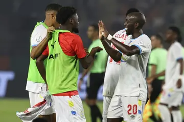 Yoane Wissa (R) celebrates with his DR Congo teammates after their 0-0 draw with Tanzania which secured their place in the last 16 of the Africa Cup of Nations