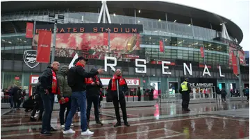 Fans outside the stadium before the UEFA Champions League Group B match at the Emirates Stadium. Photo by Nigel French.