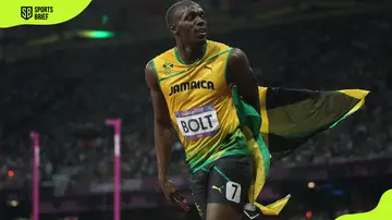 Usain Bolt celebrates after he wins gold