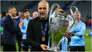 Pep Guardiola poses with the Champions League trophy after the UEFA Champions League 2022/23 final match between Inter and Manchester City. Photo by Craig Mercer.