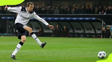 Peter Crouch of Tottenham Hotspur scores against AC Milan
