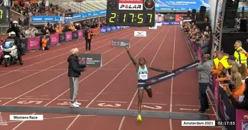 Angela Tanui cuts the tape during the Amsterdam Marathon. Photo: Twitter.