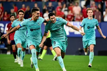 Barcelona beat Osasuna thanks to Robert Lewandowski's(2R) penalty with four minutes remaining at El Sadar on Sunday