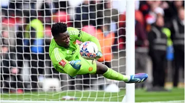 Andre Onana saves the third penalty by Callum O'Hare of Coventry City during the Emirates FA Cup semi-final at Wembley Stadium. Photo by Michael Regan.