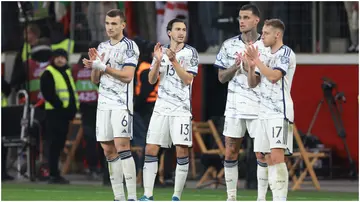 Alessandro Buongiorno, Matteo Darmian, Gianluca Scamacca and Davide Frattesi of Italy applaud the Ukraine players as they salute their fans following the final whistle of the UEFA Euro 2024 qualifier. Photo by Jonathan Moscrop.