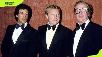 Bobby Moore posing for a photo with actor Sylvester Stallone and Michael Caine