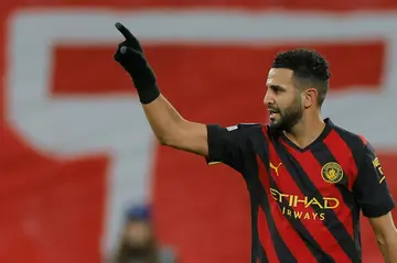 On target: Manchester City's Riyad Mahrez celebrates scoring