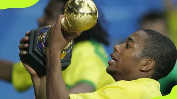 Robinho celebrates with World Cup trophy