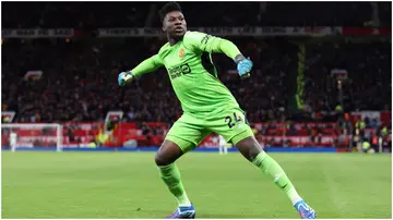 Andre Onana celebrates during the Premier League match between Manchester United and Tottenham Hotspur at Old Trafford. Photo by Alex Livesey.