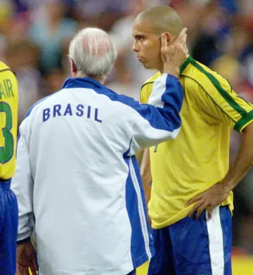 Mario Zagallo (L) consoles Ronaldo after defeat by France in the 1998 World Cup final in Paris