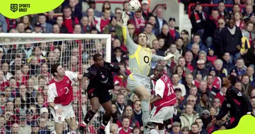 Arsenal's former goalie David Seaman blocks a goal during a match against Charlton Athletic