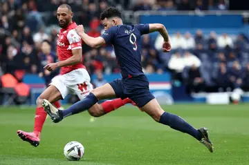 PSG's Goncalo Ramos (R) takes on Reims captain Yunis Abdelhamid during the 2-2 draw in Ligue 1