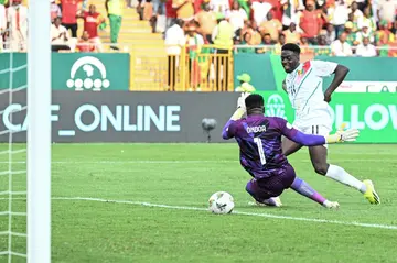 Mohamed Bayo (R) scores for Guinea against Cameroon in Yamoussoukro.