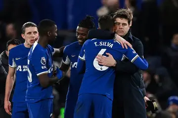 Chelsea boss Mauricio Pochettino (right) hugs defender Thiago Silva