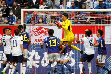Japan's goalkeeper Shuichi Gonda makes a save during a 2-0 win over the USA