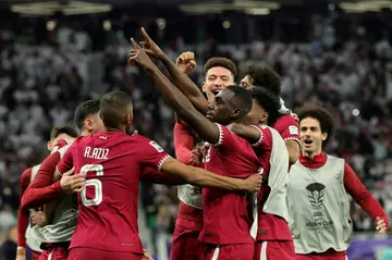 Qatar's forward Almoez Ali celebrates his winner over Iran