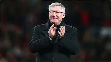 Sir Alex Ferguson celebrates victory and winning the Premier League title at Old Trafford in 2013. Photo by Alex Livesey.