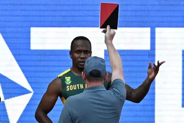 Akani Simbine is disqualified.