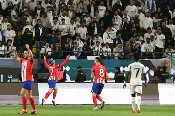 Atletico Madrid's French forward Antoine Griezmann celebrates after scoring his record-extending goal against Real Madrid