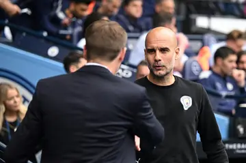 Manchester City manager Pep Guardiola (right) has apologised to Steven Gerrard (left)