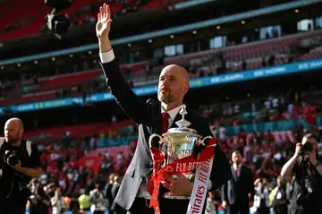 Erik ten Hag holds the FA Cup after Manchester United won the final 2-1 against Manchester City on May 25