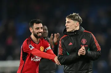 Manchester United's Bruno Fernandes (L) and Alejandro Garnacho