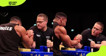 Who has defeated Schoolboy in arm wrestling?
