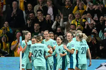 Australia's players celebrate after Australia's forward #16 Hayley Raso scored her team's second goal during the Australia and New Zealand 2023 Women's World Cup Group B football match between Canada and Australia at Melbourne Rectangular Stadium, also known as AAMI Park, in Melbourne on July 31, 2023.