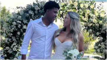 Andrey Santos poses with his wife after tying the knot in Brazil. Photo: @catarinagentilee.