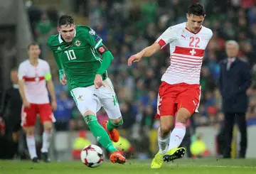 Kyle Lafferty (left) has been released from the Northern Ireland squad after appearing to make a sectarian remark in a video posted online