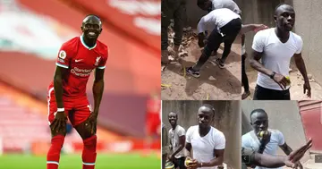 Liverpool superstar Sadio Mane spotted enjoying mangoes with friends in his village in Senegal