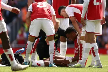 Arsenal's Jurrien Timber (centre) suffered an injury on his Premier League debut