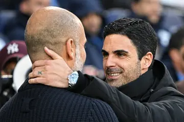 Manchester City manager Pep Guardiola (left) is going head to head with Arsenal's Mikel Arteta for the Premier League title