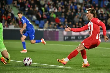 Atletico Madrid forward Antoine Griezmann netted a hat-trick as his side thrashed Getafe to secure Champions League football