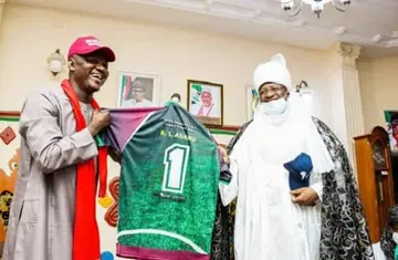 Emir of Bauchi Alhaji Rilwanu Suleiman Adamu receives a shirt from Noah Dallaji