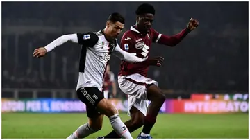 Ola Aina fights for the ball with Cristiano Ronaldo during the Italian Serie A football match Torino vs Juventus on November 2, 2019. Photo: Marco Bertorello.