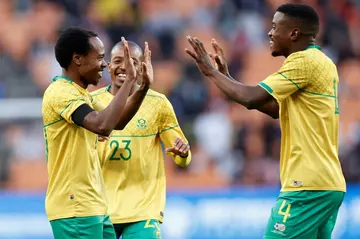 Percy Tau (L) celebrates a South African goal against Morocco in a 2024 Africa Cup of Nations qualifier in Johannesburg