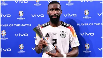 Real Madrid's Antonio Rudiger poses with his Player of the Match trophy after Germany's win over Denmark at Football Stadium Dortmund on June 29, 2024. Photo: Oliver Hardt.