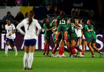 Mexico's players celebrate after their 2-0 upset of the United States at the CONCACAF women's Gold Cup