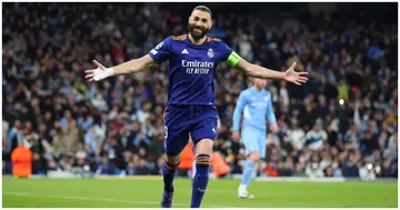 Karim Benzema celebrates scoring a goal from the penalty spot during the UEFA Champions League Semi Final Leg One match between Man City and Real Madrid. Photo by Marc Atkins.
