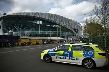 A police car outside the Tottenham Hotspur Stadium