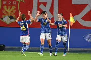 Japan celebrate scoring against China