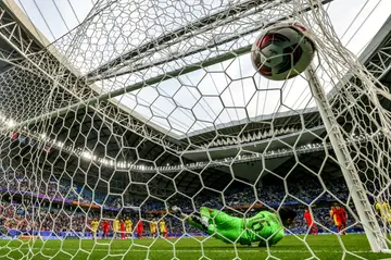 Malaysia's goalkeeper Syihan Hazmi is beaten by Son Heung-min's penalty