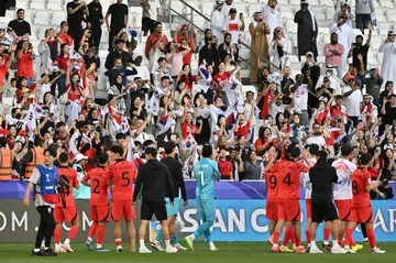 South Korea's players celebrate with their fans